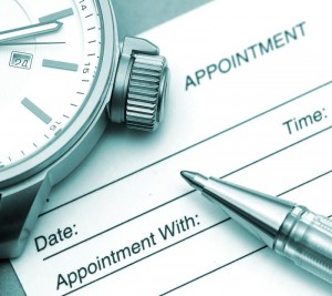 Appointment Clock and Pen on an Appointment Form