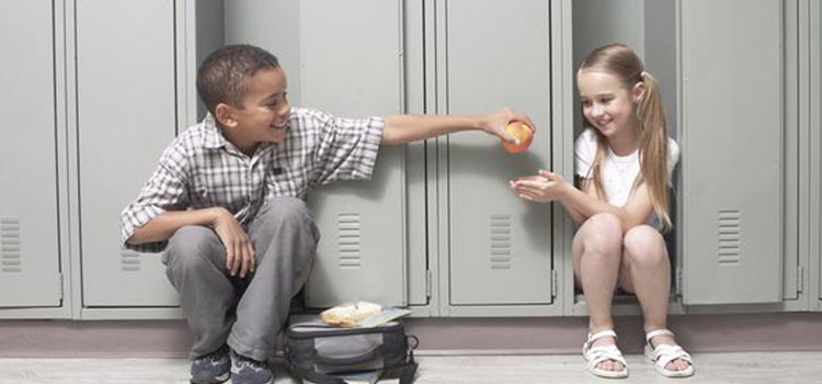 Boy sharing Peach with girl